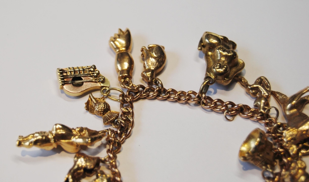 Gold curb bracelet with various charms, mostly 9ct, 58.8g gross. - Image 3 of 4