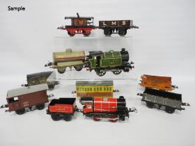 Collection of Hornby by Meccano O gauge locomotives and carriages comprising two clock