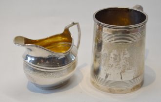 Silver reeded mug of Georgian style, 1926, and a similar engraved silver cream jug, 1913, 311g or