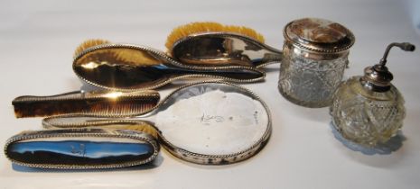Silver five-piece brush set and two silver mounted glass items.