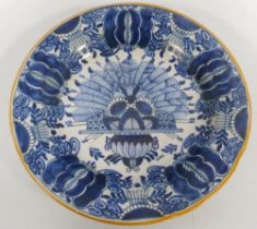 18th century Delft blue and white pottery faience peacock plate, underglazed in blue on a white