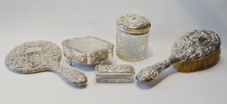 Silver bijouterie box of waved oval shape and four similar silver items, embossed.  (5)