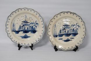 Pair of late 18th century creamware blue and white plates, 24.5cm diameter.  (2)