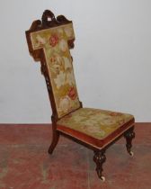 Victorian walnut prie dieu upholstered in floral stuff-over embroidery above velour to the frieze,