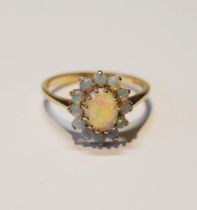 Opal oval cluster ring, in 9ct gold, size O.