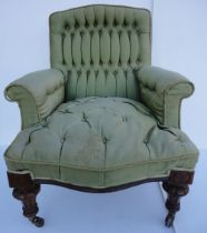 Victorian walnut armchair upholstered in period green button-back moquette, on fluted squat feet,