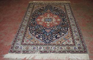 Persian Tabriz hand-knotted rug with large foliate medallion to the centre within all over