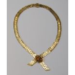 9ct gold necklace of textured brick pattern, with gem-set slide, 50g gross.