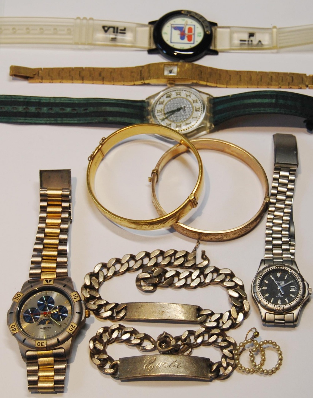Two silver bracelets, two bangles, five watches and various other items.