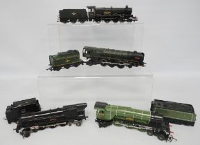 Four Hornby OO gauge locomotives and tenders comprising a 4472 green 'Flying Scotsman', 7028 Cadbury