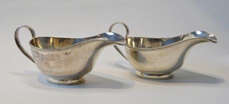 Pair of silver sauce boats with gadrooned borders, on collet feet, Sheffield 1939, 145g or 4½oz.  (