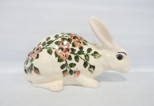Griselda Hill (Wemyss) Large figure of a rabbit decorated with underglazed wild roses, on green