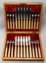 Set of twelve silver fruit knives and twelve forks, white handles, by Mappins, Sheffield 1898,