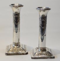 Pair of silver boudoir dwarf candlesticks, embossed, Birmingham 1912, 15cm, loaded.