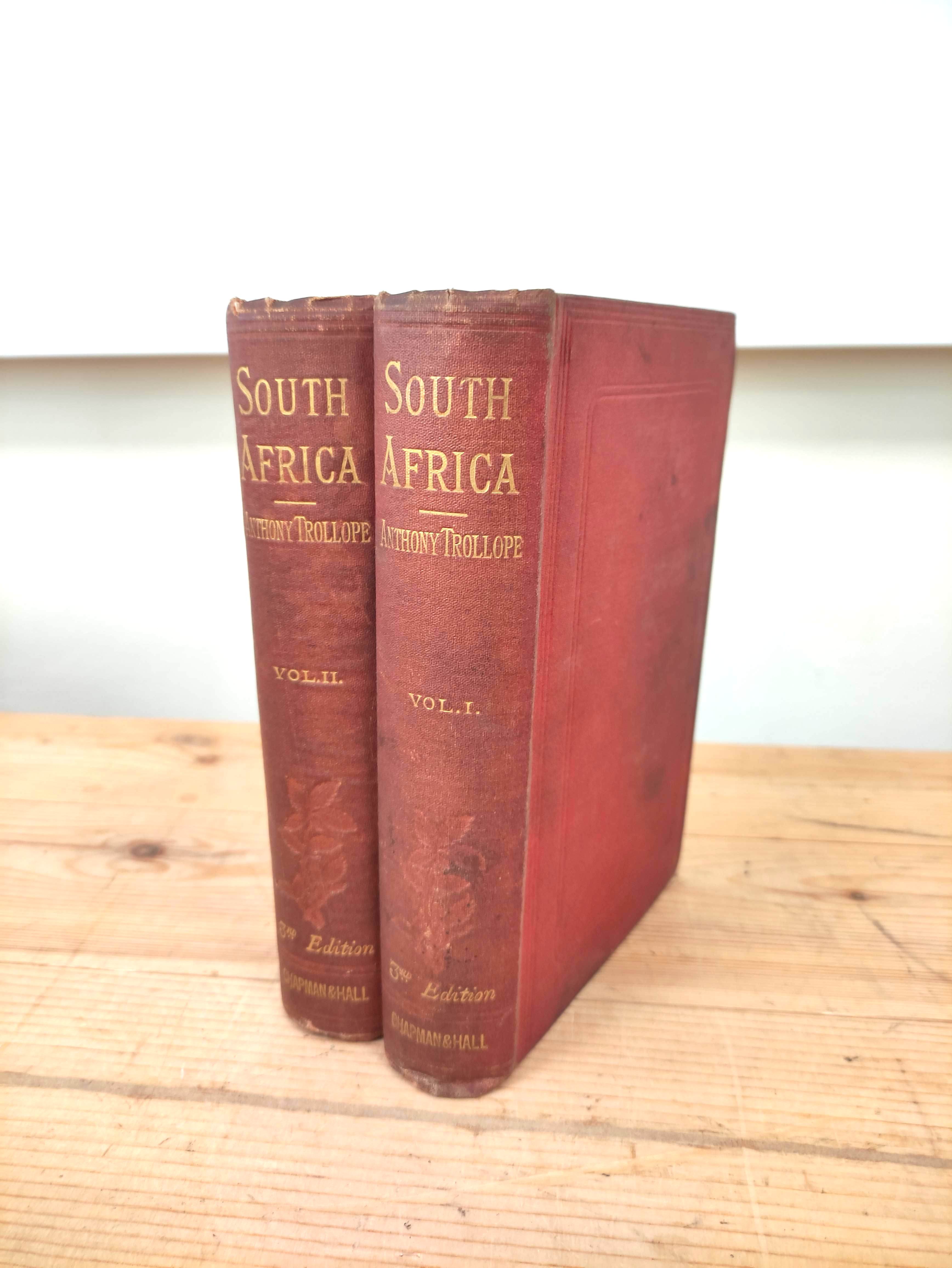 TROLLOPE ANTHONY.  South Africa. 2 vols. Fldg. col. map (torn). Soiled orig. red cloth. 3rd ed.,