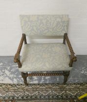 Antique oak bobbin open armchair upholstered in later fabric, 78cm high.