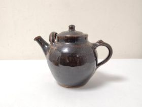 Ray Finch, Winchcome Studio pottery treacle glazed teapot with cover, 17cm high.