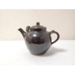 Ray Finch, Winchcome Studio pottery treacle glazed teapot with cover, 17cm high.