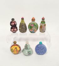 Group of seven Chinese glass snuff bottles, to include famille rose double gourd and overlaid