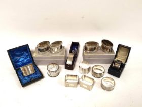 Thirteen silver napkin rings, some cased. 380g. 12oz.