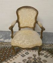 19th century giltwood ladies fauteil in the French Louis XV style, upholstered in later stuffover