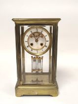 Late 19th century French gilt brass four glass mantel clock, the twin train enamel dial with