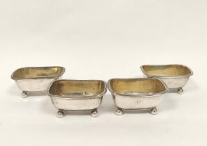 Set of four silver salts of boat shape, reeded edges on ball feet by Emes and Barnard 1810, 9.4cm,