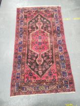 Persian Hamadan hand knotted rug, with large geometric medallion to the centre, further geometric