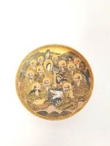 Japanese Meiji period Satsuma dish, decorated with "thousand faces" and dragon and profusely