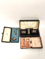 Silver three piece condiment set, plain oval, Birmingham 1935 and a spoon and pusher, both cased.