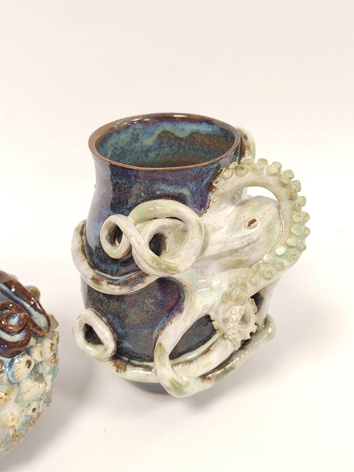Two Studio pottery vases (Hexham?) each decorated with moulded octopus, drip glazed in blue, - Image 2 of 3