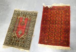 Bokhara rug on red ground, 126cm x 80cm with Afghan rug, 115cm x 80cm (2)