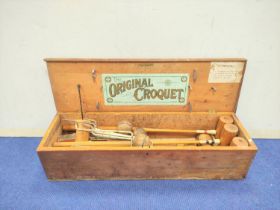 The Original Croquet set by F.H Ayres - London, Housing mallets, balls etc, with original label to