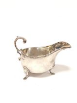 Silver sauce boat with gadrooned edge on pad feet. Birmingham 1901. 170g. 5.5oz.