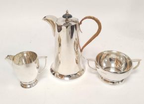 Silver hot water pot of plain spreading shape by Walker & Hall, Sheffield 1947. 430g. 14oz. gross.