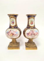 Pair of Sevres style Continental porcelain vases decorated with panels of winged putti and objects