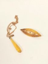 Victorian 15ct. gold brooch of lozenge shape with tiny diamond, 3.6g, metal pin; also a citrine