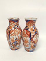 Pair of Japanese Meiji period imari vases, With allover foliate borders, 31cm high. (2)