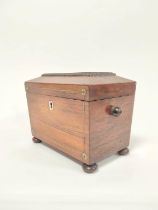 Early 19th century rosewood tea caddy, with mother of pearl inlay and escutcheon, enclosing twin