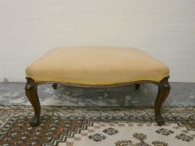 Victorian French style walnut centre stool with later upholstered stuffover top on shaped sabre