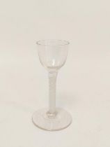 Georgian wine glass with ogee bowl on opaque air twist column and conical foot, 14.5cm high.