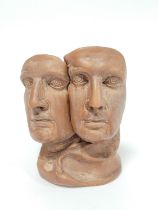 Modernist clay sculpture modelled as twin busts of a male head, in similar style to the busts of