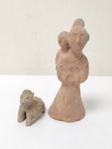 Antique Chinese Tang style earthenware figure of a woman carrying a child, unglazed but with