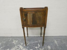 Late 19th century mahogany pot cupboard with pierced tray top above single door and raised on turned