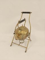 Late Victorian hammered brass tea kettle of ovoid shape upon rustic stand with turned ebony