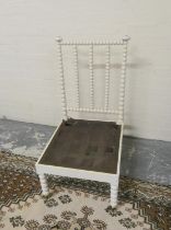 Antique painted bobbin turned chair on brass caps and castors, 101cm high.