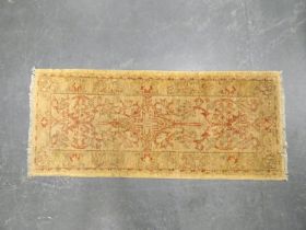 Indian Ziegler style hand knotted rug with allover floral motifs on beige ground, 154cm x 64cm.