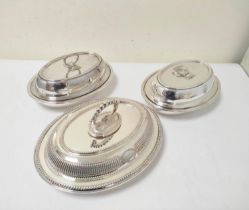 Pair of e.p. oval entree dishes by Gorham, the covers with pivoting handles, and another oval entree