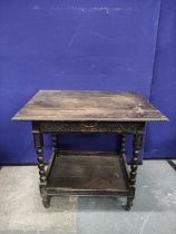 Antique oak side table with drawer and undertier, with gadrooned edges and carved decoration upon