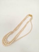 Three row necklace of graduated pearls on 9ct gold Ciro rectangular snap.